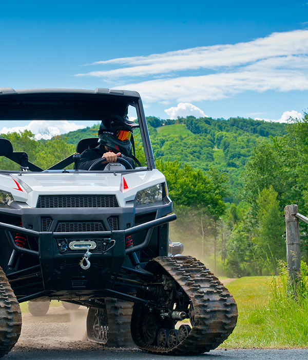 Rider on a UTV equipped with WSS4 track kits